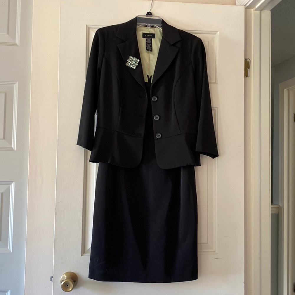 A line dress black with a jacket.
